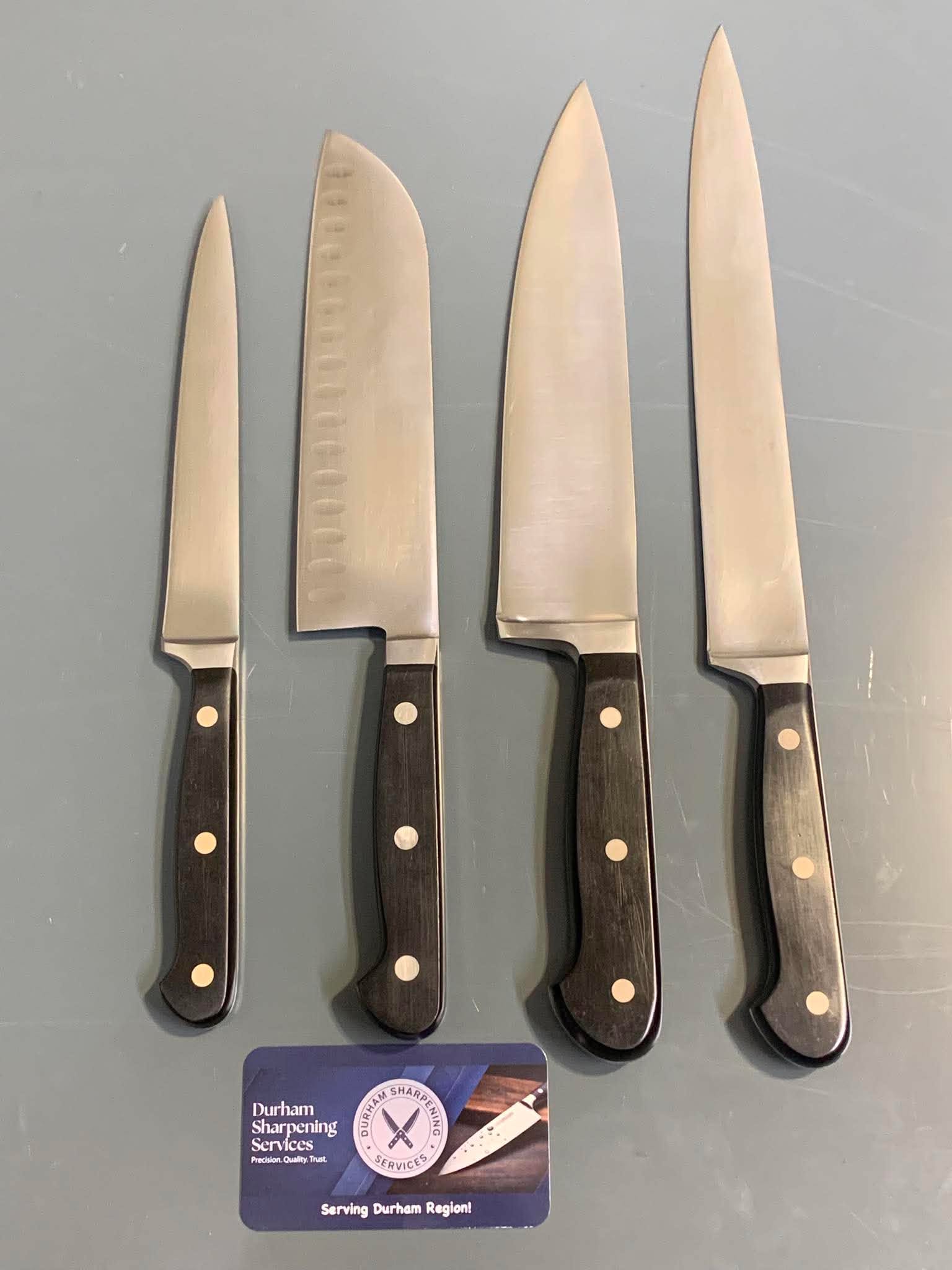 Chef knife set with dark handles – after sharpening